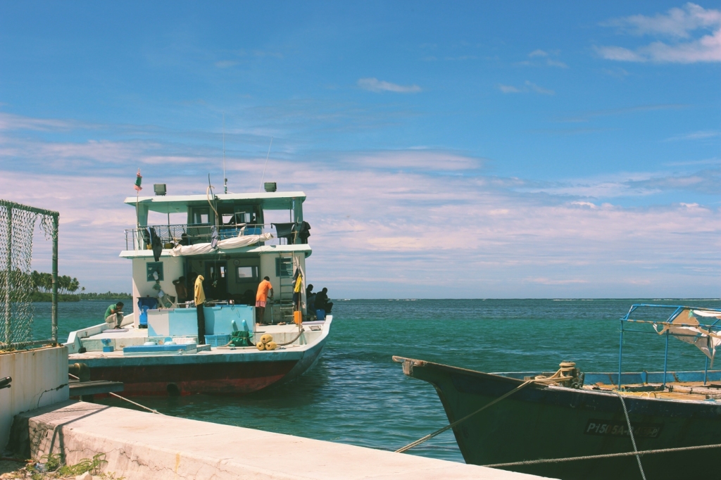 Siraj's father happened to be in his fishing boat at the docks on the island! We popped over and said hello, and Siraj passed him some chocolates and money for him and his mother, living in the next atoll up, Gaafu atoll